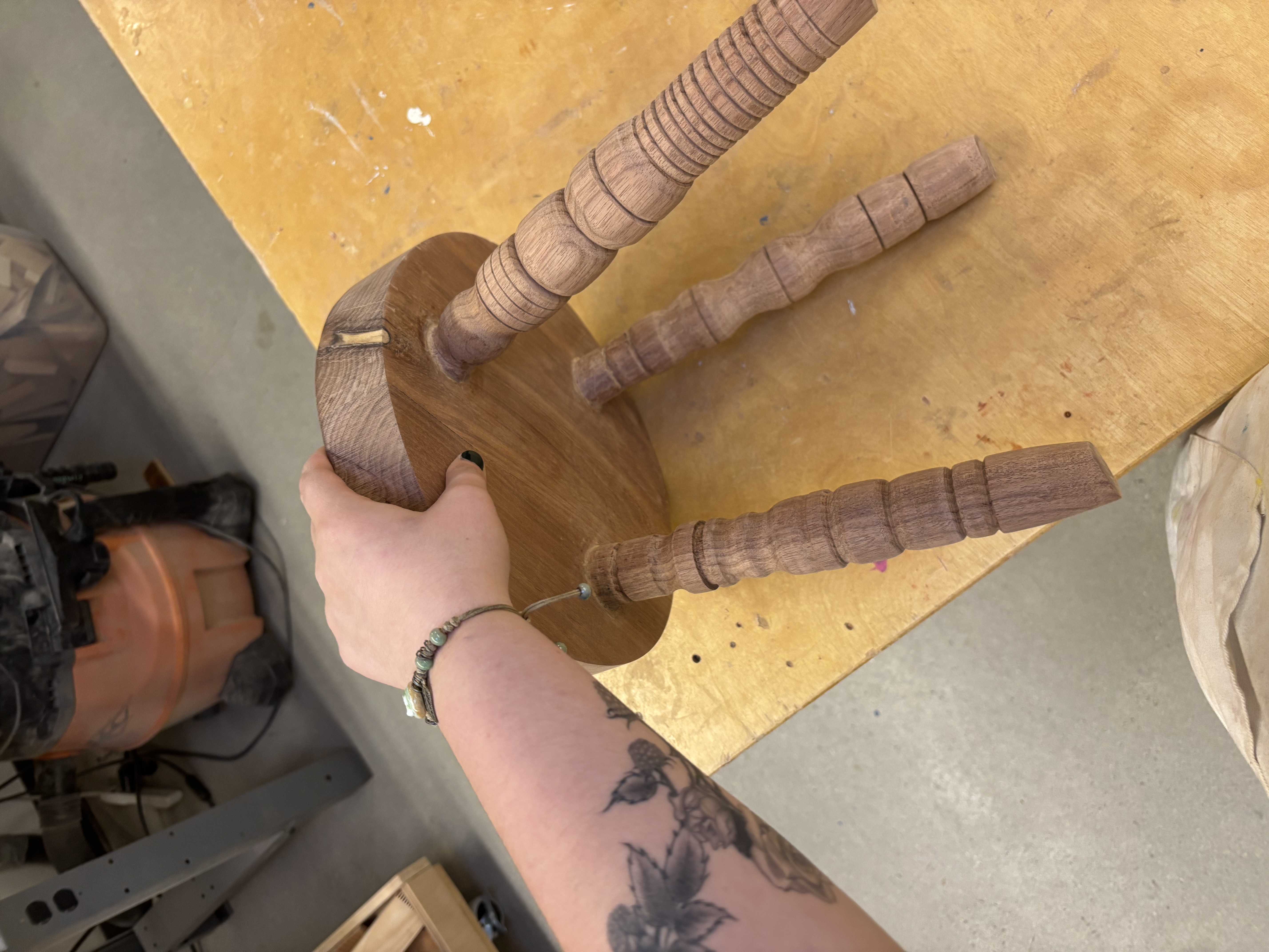 Joined the legs to the stool using wood glue and small wedges in legs to secure the fit